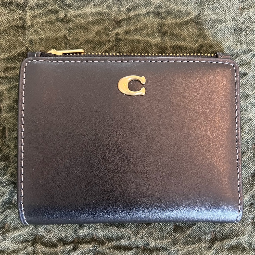 Coach Bifold wallet in smooth black leather.